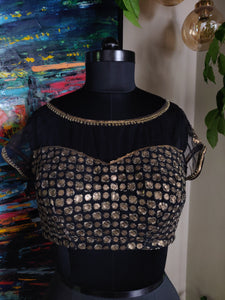 Black boat neck blouse with dull gold embroidery