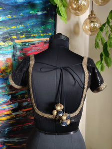 Black and gold sequin blouse